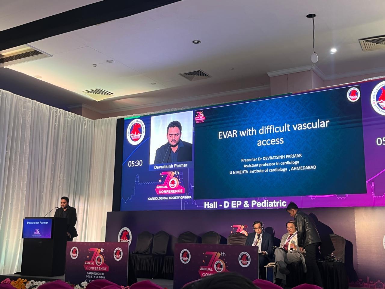 Dr. Parmar presenting at the podium